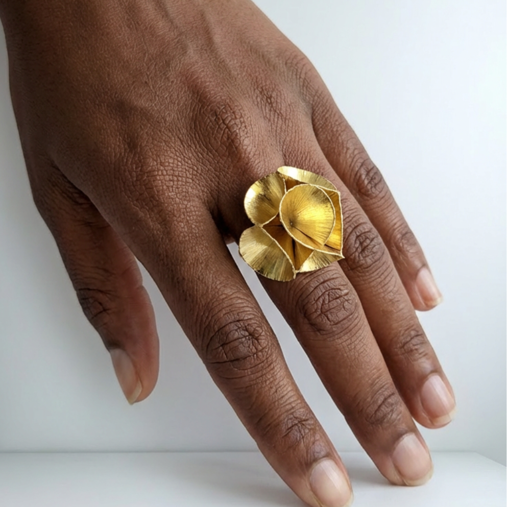 Contemporary gold flower ring handcrafted in Colombia with sculptural organic design