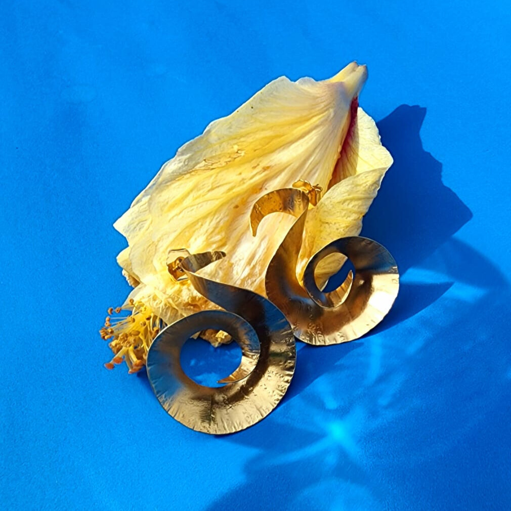 Handcrafted Twisted Spiral Earrings 24k gold-plated bronze artisan jewelry environment